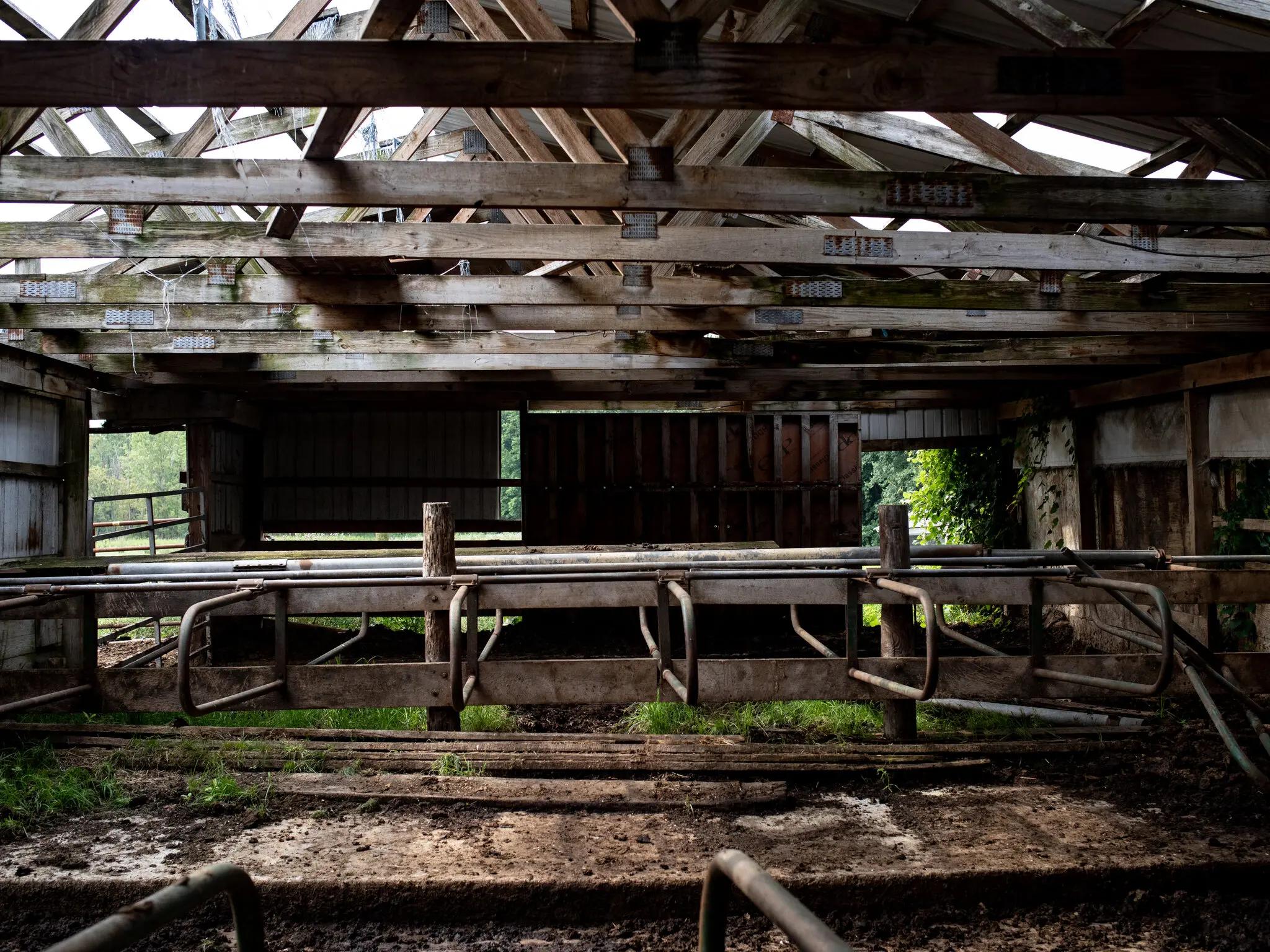 A cattle barn in Michigan, now empty, after the land and the animals were found to be contaminated.